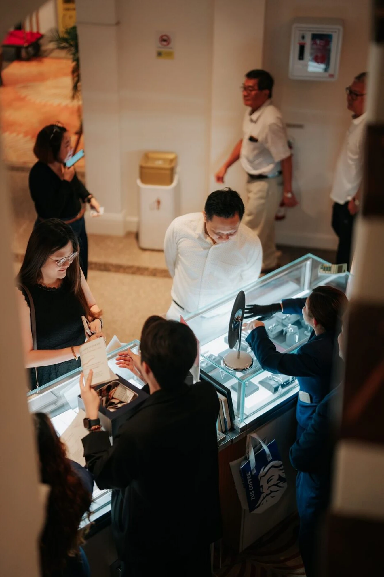 Guests viewing the Diamond & Platinum jewellery booth display